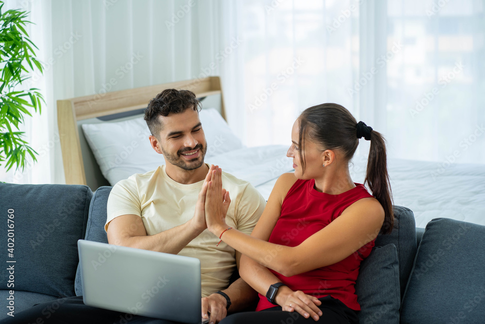 Caucasian couple lovers work from home new normal with computer laptop Caucasian couple lovers work from home new normal with computer laptop