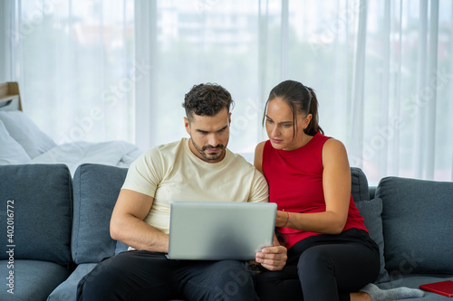 Caucasian couple lovers work from home new normal with computer laptop notebook