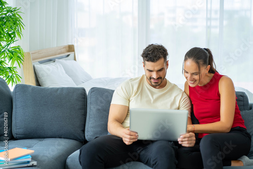 Caucasian couple lovers work from home new normal with computer laptop 