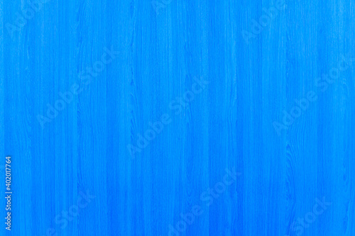 Blue Color Texture. Blue plywood surface. Abstract concept for the background. Vertical lines of plywood are painted blue throughout the sheet for the background of product advertising. blue wood.