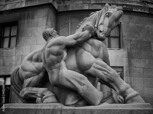 Man Controlling Trade. Equestrian statue created by Michael Lantz for the Apex Building in Washington DC under the WPA Federal Art Project. Dedicated in 1942. Limestone. Black and White photo