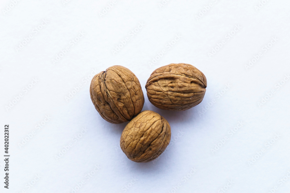 Healthy shelled walnuts in the palm of the man.
Hard shell walnuts.Walnuts on a white background Healthy shelled walnuts in the palm of the man.
Hard shell walnuts.Walnuts on a white background