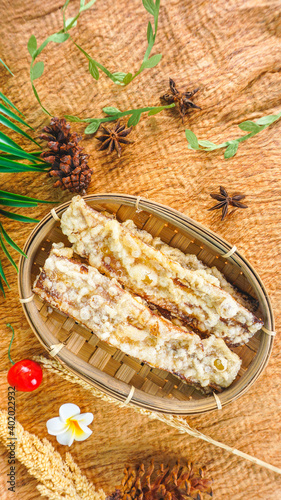 CIREBON, West Java INDONESIA - December 28th 2020 - Dried Banana (Sale Pisang) wooven bamboo tray. photo