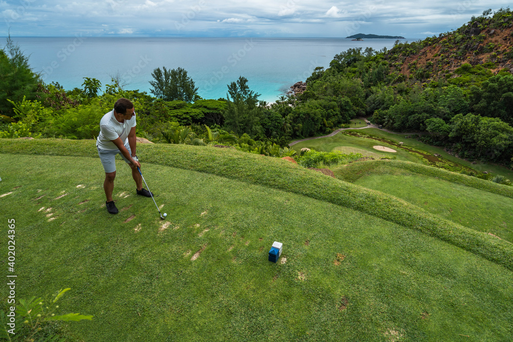 Tropical Golf course hole nr. 15 Lemuria Resort Praslin Seychelles golfer  tee shot Anse Georgette Stock Photo | Adobe Stock