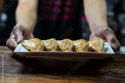 Japanese gyoza served in plate with delicious soy sauce dip