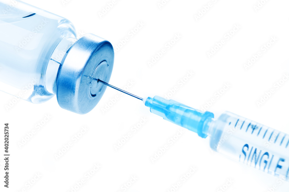 Medical syringe with a needle and a bollte with vaccine. Medical syringe with a needle and a bollte with vaccine.