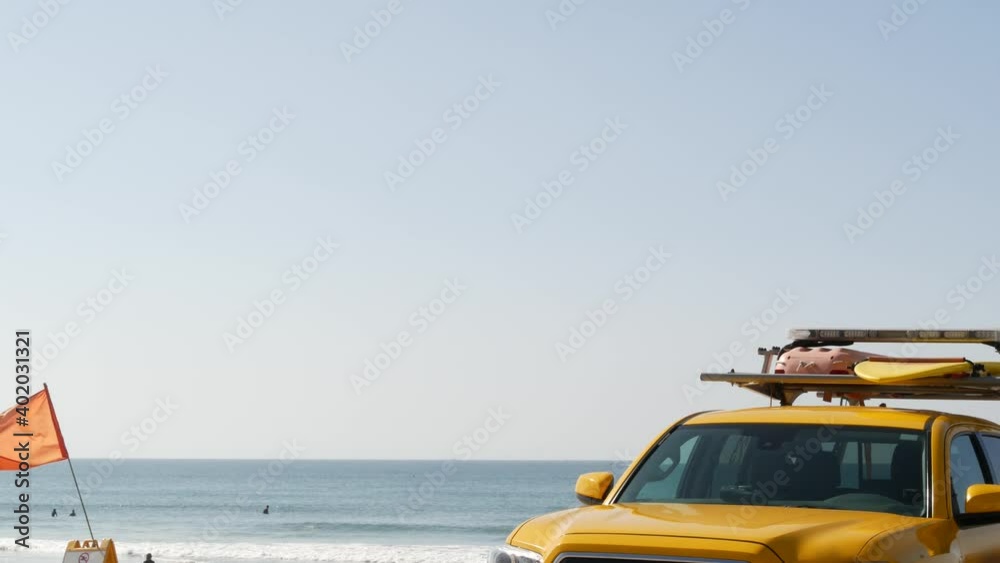 Yellow lifeguard car, Oceanside beach, California USA. Coastline rescue life guard pick up truck, lifesavers vehicle. Iconic auto and ocean coast. Los Angeles vibes, summertime aesthetic atmosphere. Yellow lifeguard car, Oceanside beach, California USA. Coastline rescue life guard pick up truck, lifesavers vehicle. Iconic auto and ocean coast. Los Angeles vibes, summertime aesthetic atmosphere.