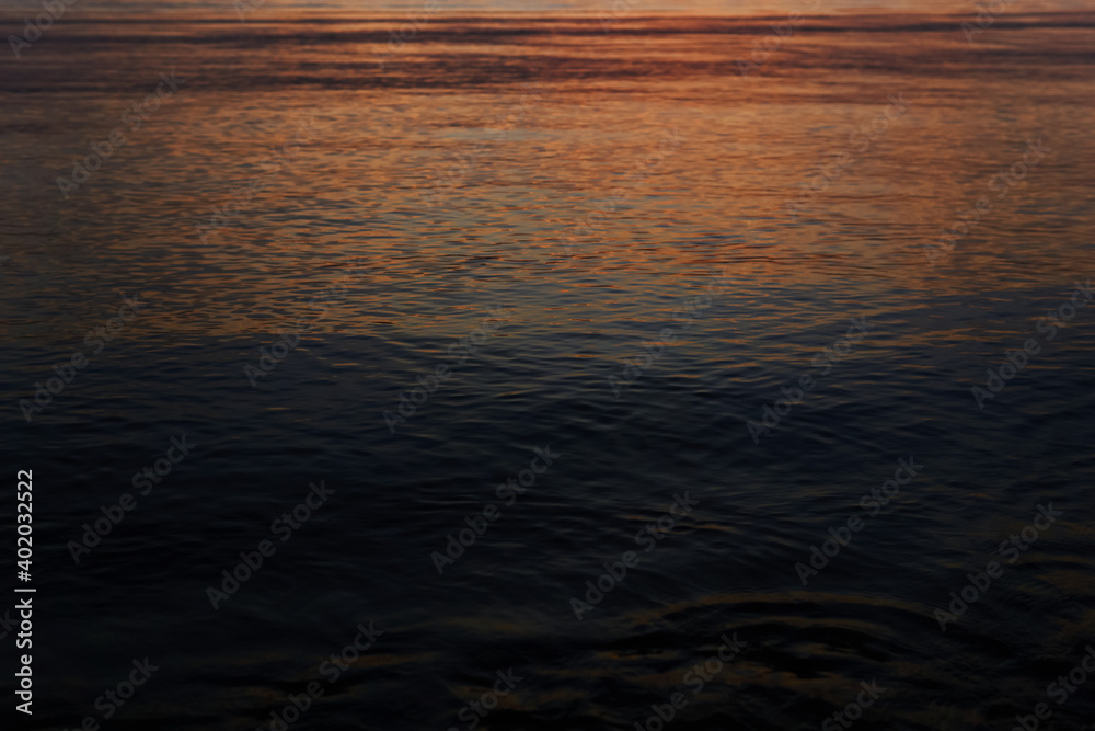dark water with a reflection of a distant dawn dark water with a reflection of a distant dawn