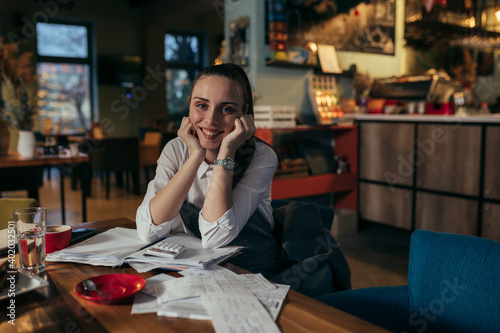 woman entrepreneur dealing with financial in her restaurant