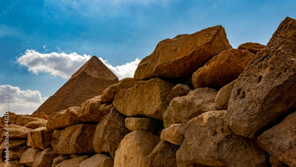 Pyramid behind an old stone wall near Giza
