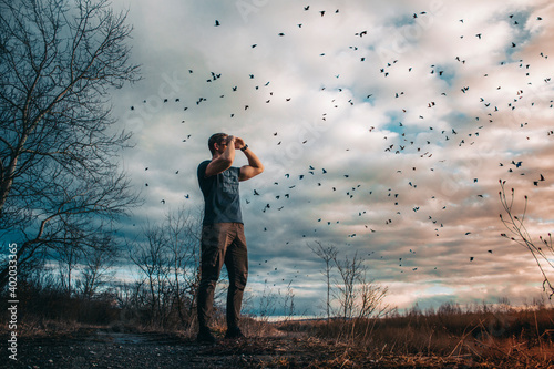 boy look at the sky birds