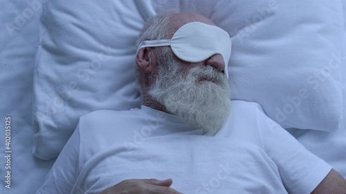 Wallpaper Mural Worried greyhaired male wearing eye mask, trying to sleep at night, insomnia Torontodigital.ca