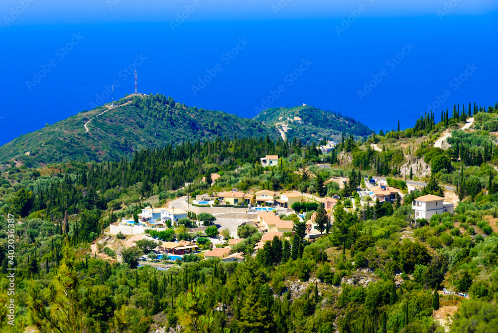 Aerial panoramic view of the coast of Lefkada island and traditional Greek village near Porto Katsiki on a sunny day in Greece