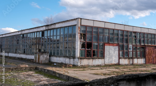 Slika na platnu abandoned factory warehouse with broken windows