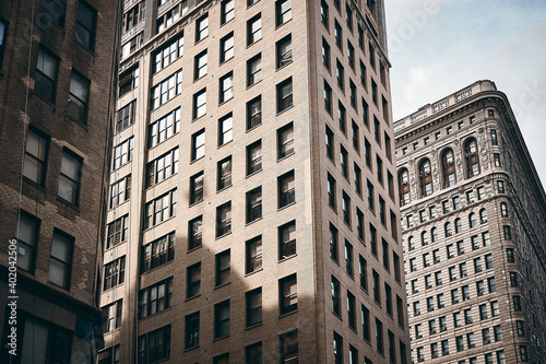 The Flatiron building of Manhattan, New York City against the cloudy sky