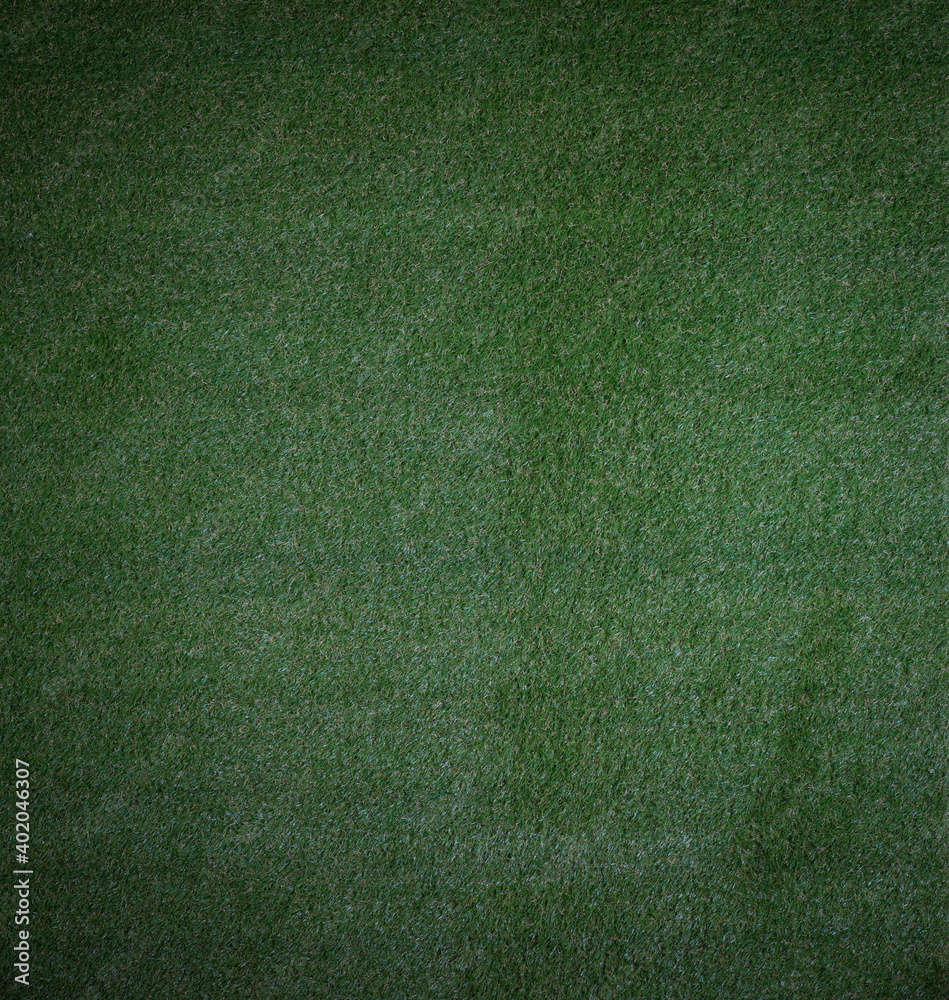 Fototapeta premium dark background of artificial green sports turf