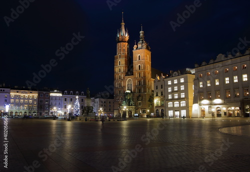 Krakow night cityscape  main market square  saint marys church  christmas tree  empty  without people