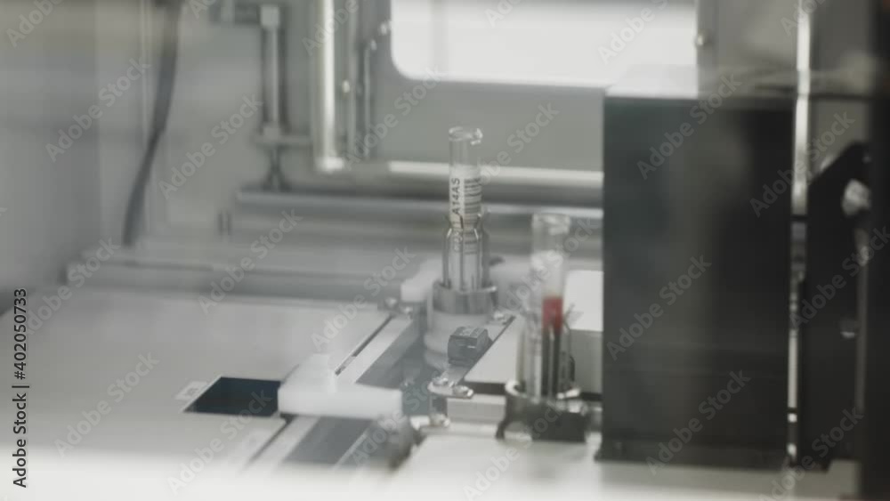 Medical laboratory equipment during treatment, automated device testing blood, serum, urine and plasma samples. Medical laboratory equipment during treatment, automated device testing blood, serum, urine and plasma samples.