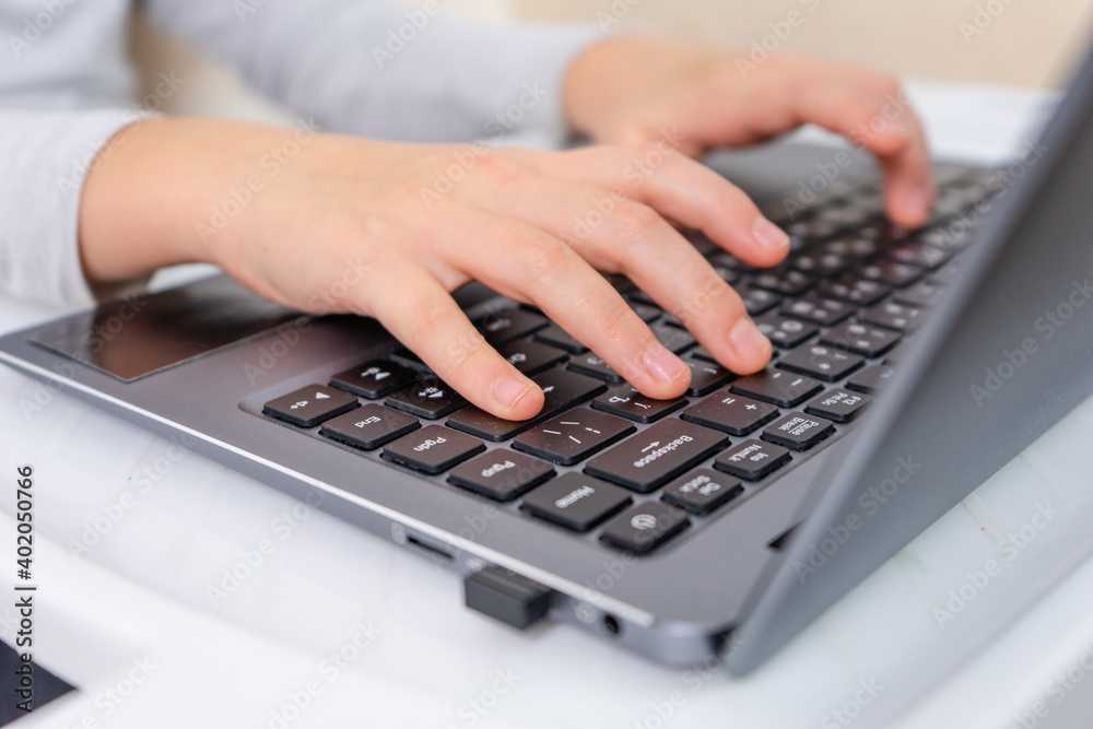 focused little kids hands pressing laptop keyboard focused little kids hands pressing laptop keyboard