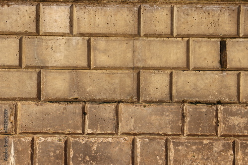 Brick wall with different sized bricks creating a pattern