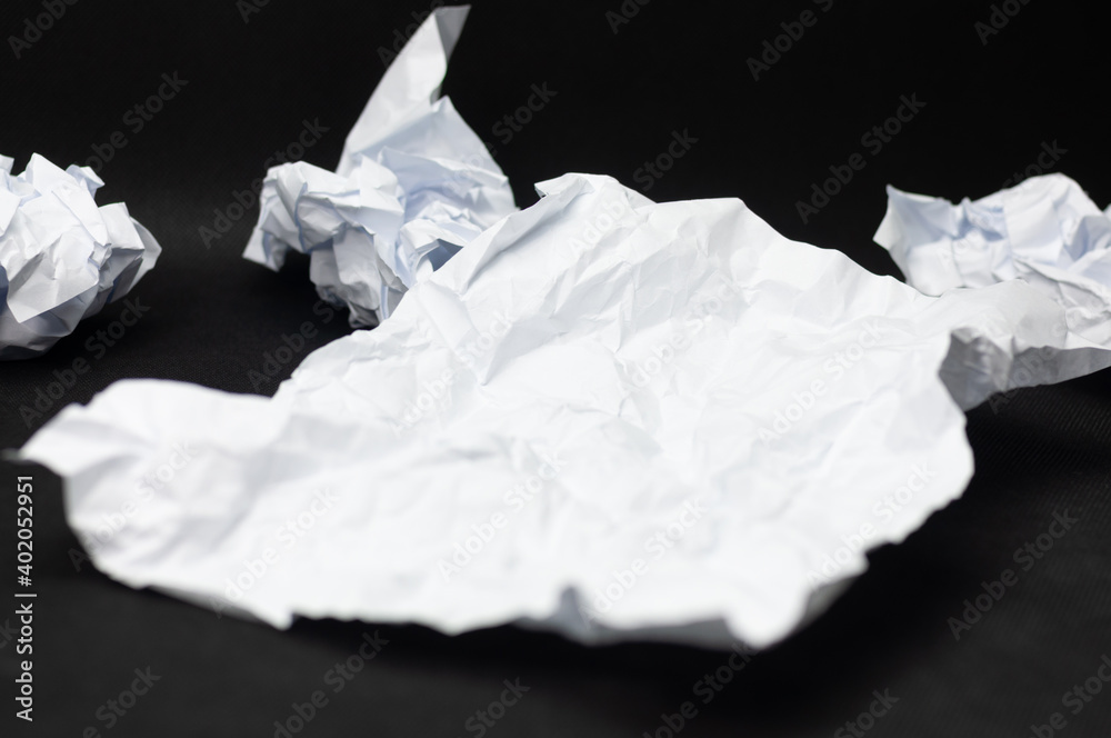 A few crumpled pieces of white paper A few crumpled pieces of white paper