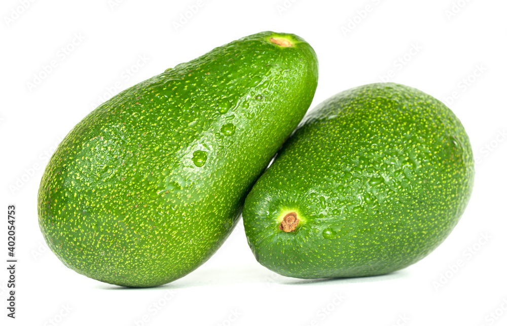 Two green avocado closeup on a white background. Two green avocado closeup on a white background.
