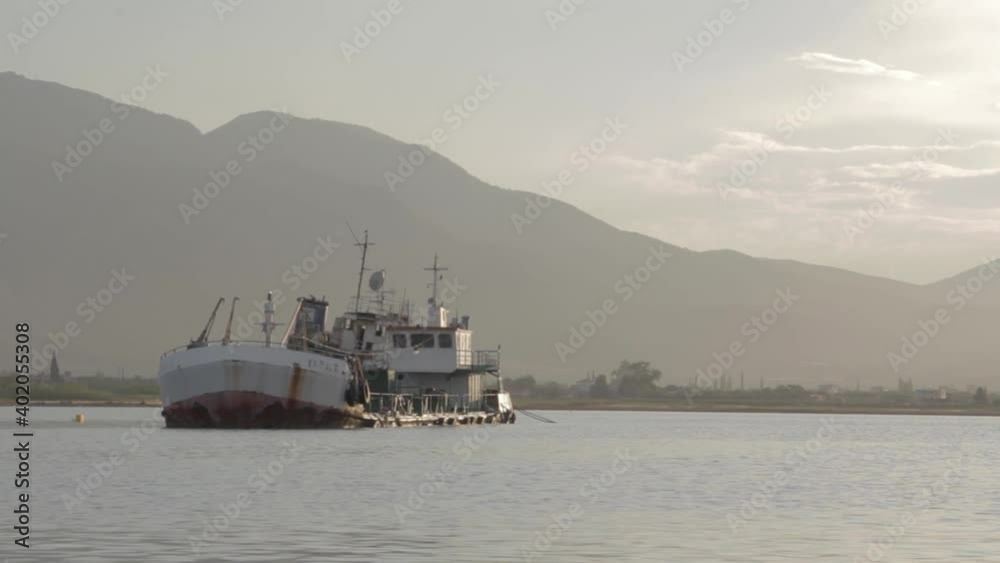 Ship wreck in sea Surrounded by mountains Ship wreck in sea Surrounded by mountains
