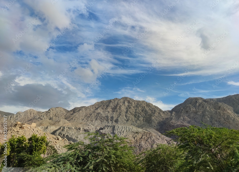 clouds over the mountains in ras al-Khaimah , united Arab emirates clouds over the mountains in ras al-Khaimah , united Arab emirates