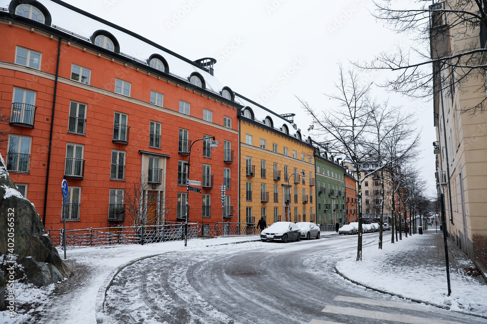 Colorful apartment building street in winter