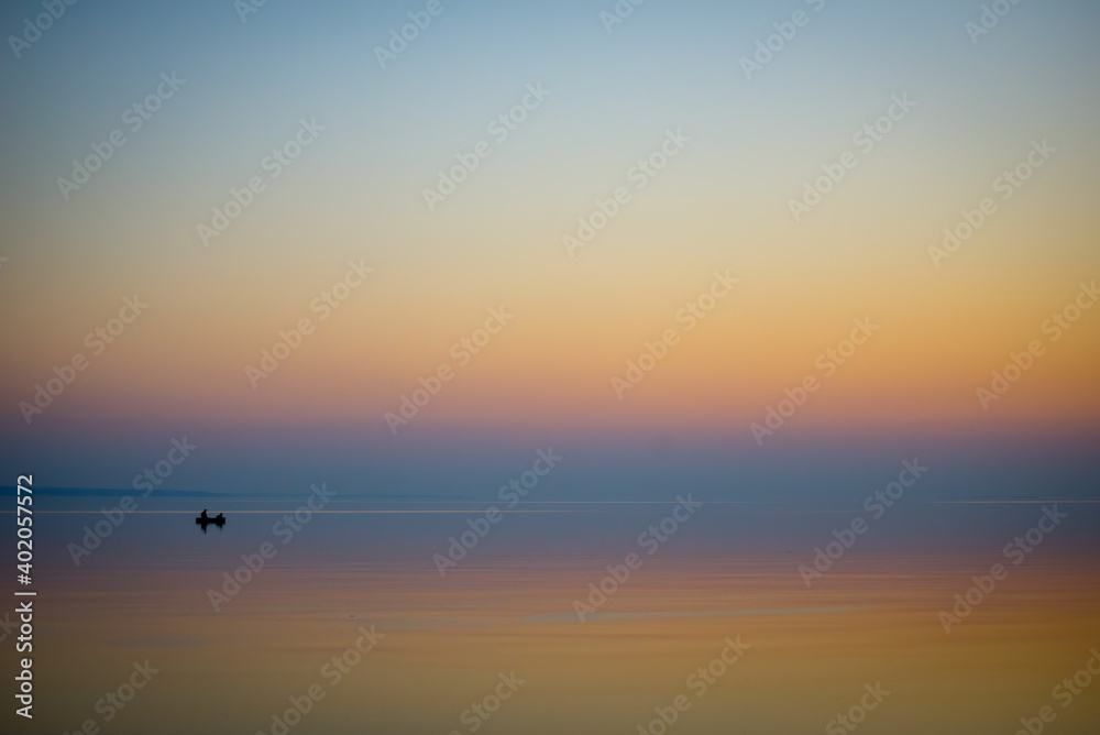 Boat in the sea at sunset