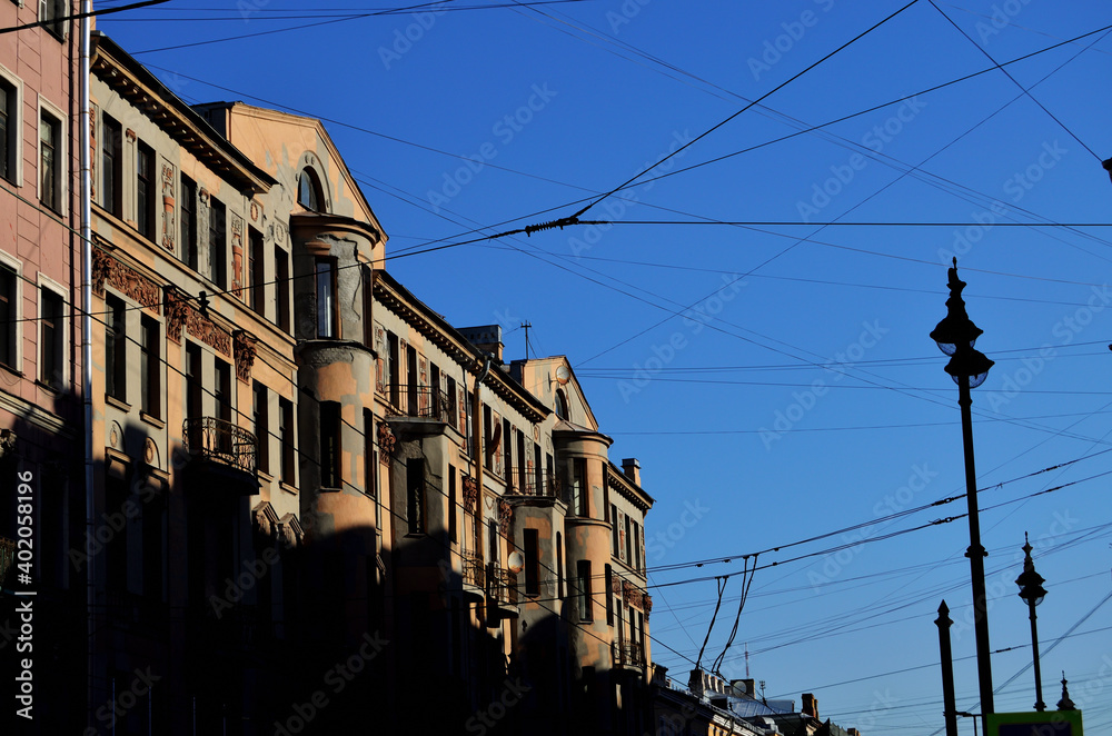 Trolleybus and electric wires over the streets of St. Petersburg Russia 19.08.2020. High quality photo