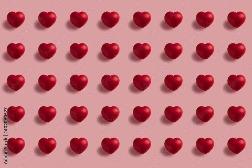 Seamless pattern of red hearts on pink background