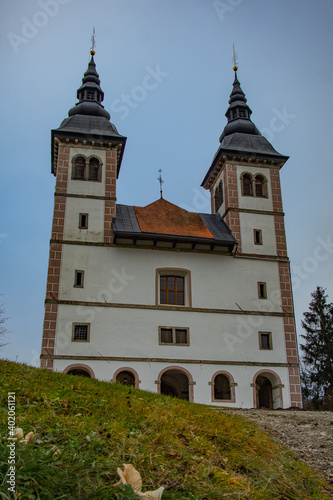 Cold late autumn panorama of Saint Volbenk church in the Poljanska valley close to Skofja Loka in Slovenia.