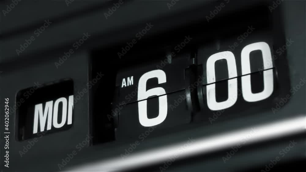 Retro flip clock changing from 5:59am to 6:00am on a Monday morning Retro flip clock changing from 5:59am to 6:00am on a Monday morning