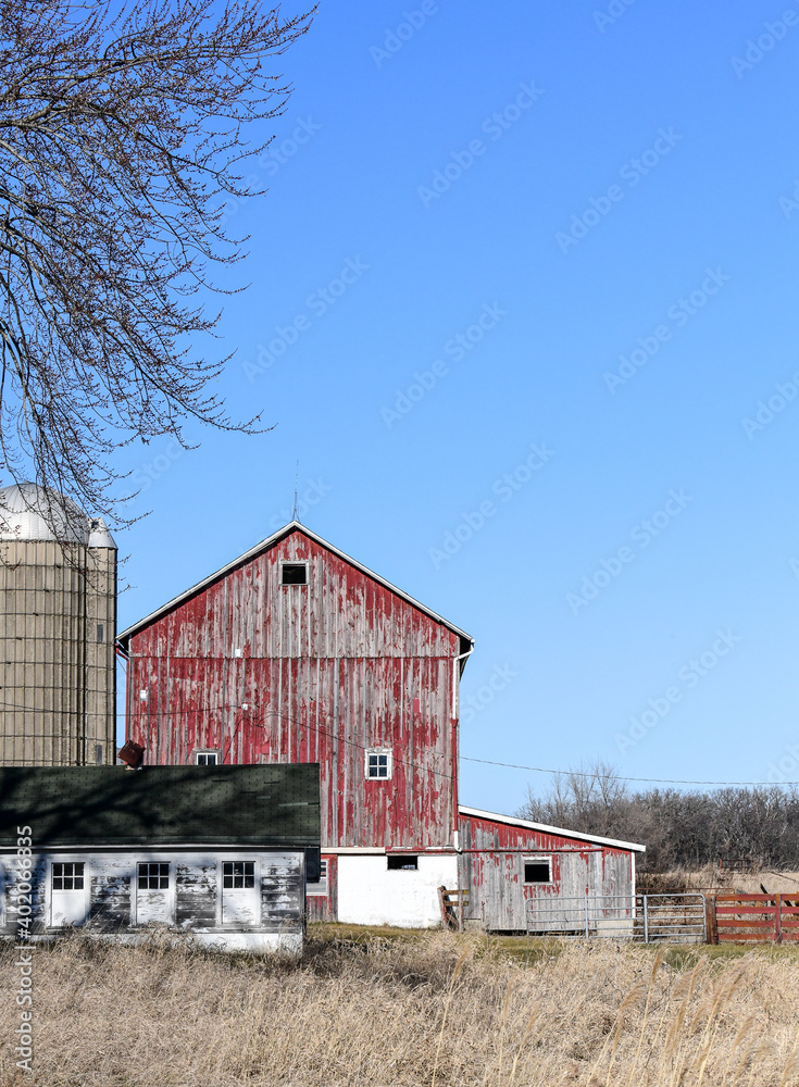 weathered red barn in the country
