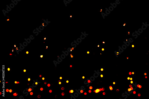 dots light black background. blurred abstract pattern, bokeh background.