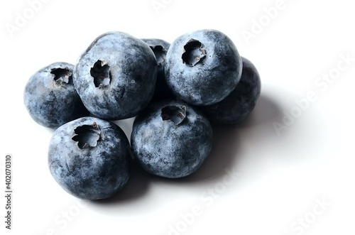 Several blueberries isolated on a white background. selective focus.