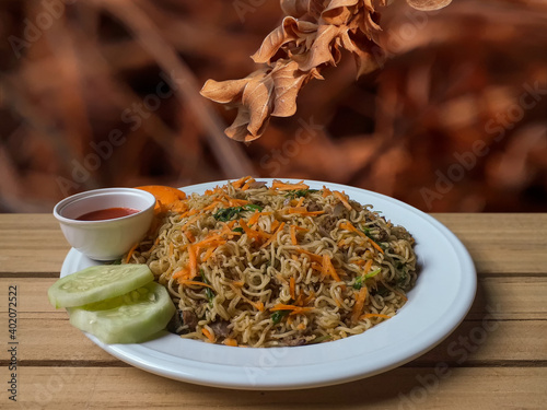 Fresh delicious food with wood board background. photo