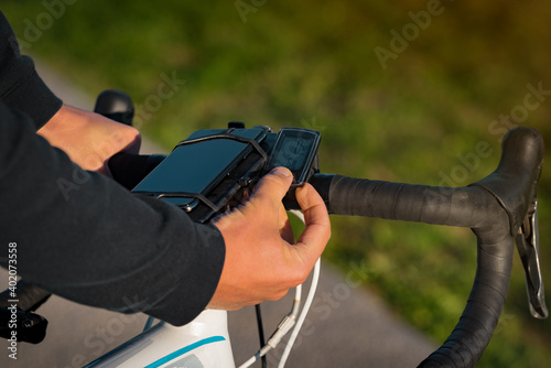 Man using bicycle speedometer. Wireless sensor for measuring speed and distance