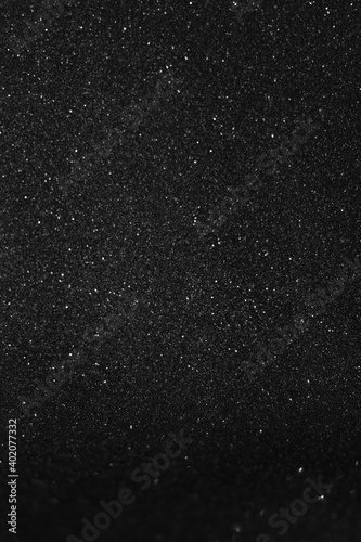Shiny black glitter texture background stock images. Texture of black glitter shiny background. Abstract black shiny background with copy space for text.