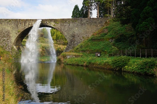 Tsujun Bridge  Traditional Arch Bridge  with flowing water in Kumamoto  Japan -                           