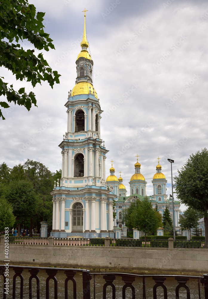Bell tower of St. Nicholas Sea Cathedral. Tall, slender tower with a spire in Baroque style on the embankment of the Kryukov kanala. Architecture of the XVIII century