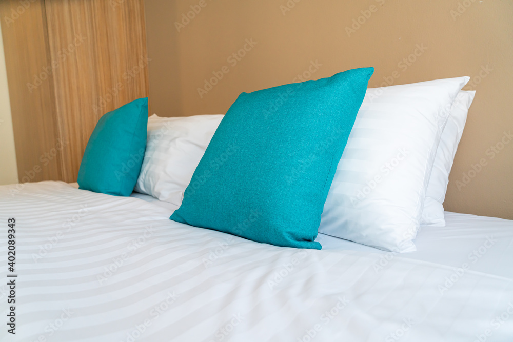 Obraz premium comfortable pillows on bed in bedroom