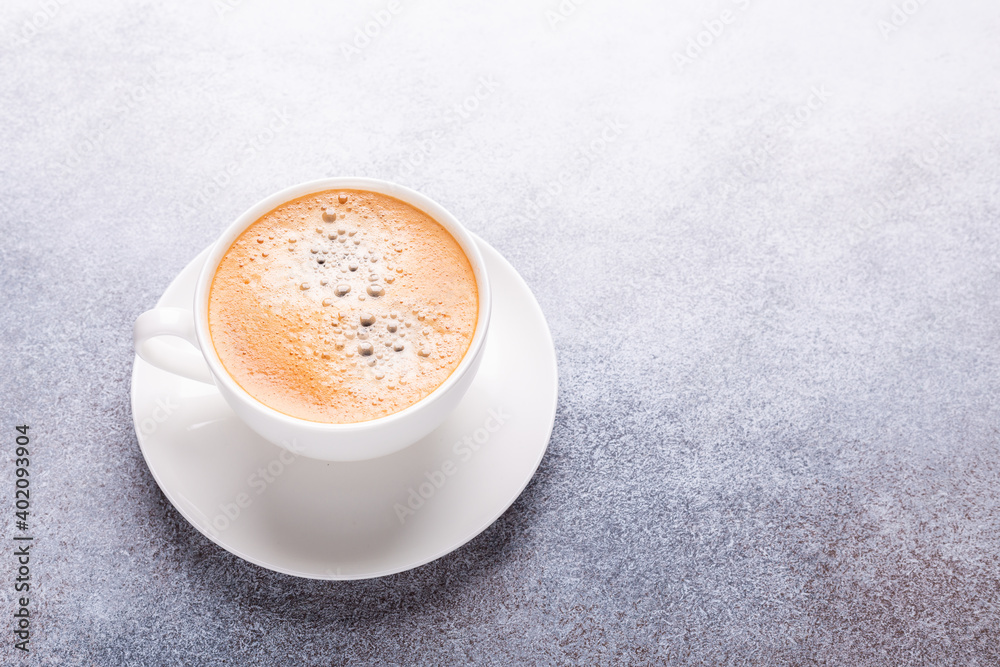 White cup of coffee on stone table. Top view White cup of coffee on stone table. Top view