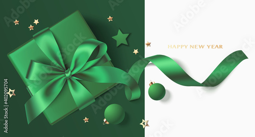 New Year and Christmas greeting card design template. Xmas green background with green ball, star, gift box and gold star confetti. Flat lay. Vector stock illustration.