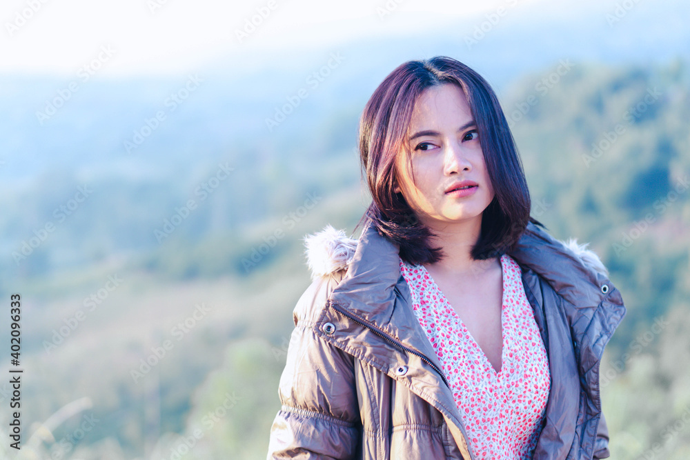 Portrait of asian happy woman smiling with Pine (Araucaria heterophylla) green leaves background. Portrait of asian happy woman smiling with Pine (Araucaria heterophylla) green leaves background.