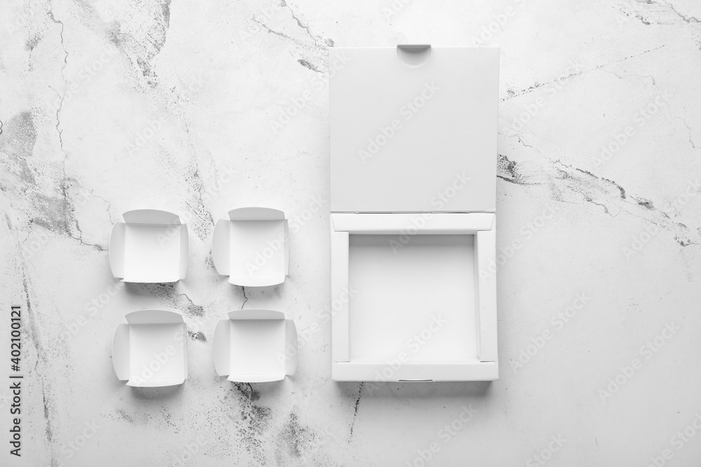 Blank cardboard boxes on light background Stock Photo | Adobe Stock