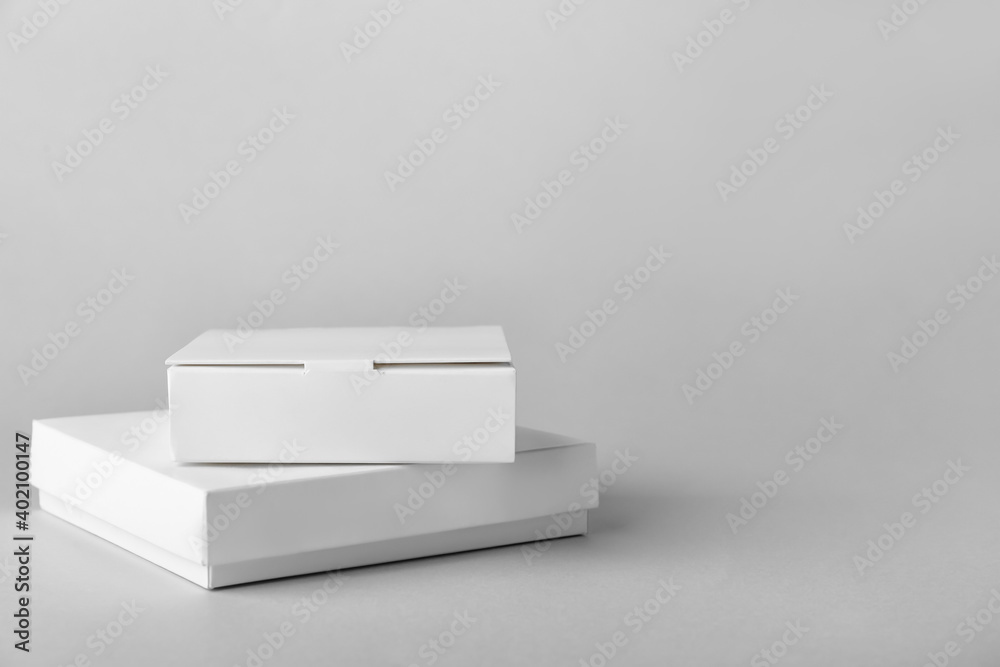 Blank cardboard boxes on light background