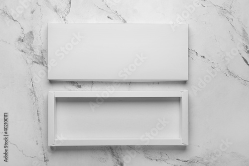 Blank cardboard box on light background © Pixel-Shot