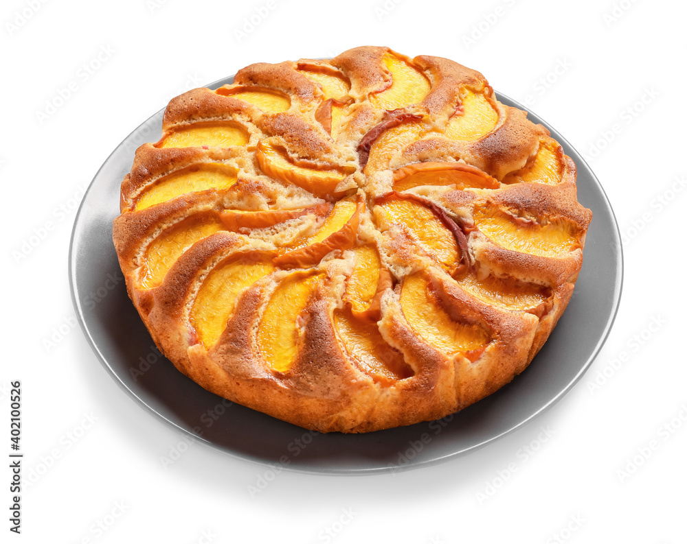 Plate with tasty peach pie on white background